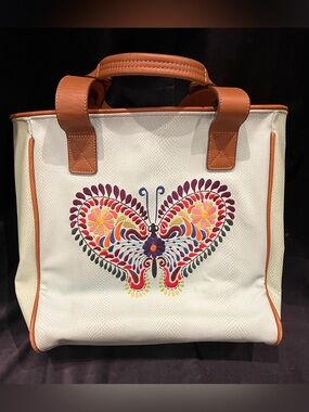 White Consuela Canvas Tote with Colorful Butterfly Embroidery and Tan Trim.
